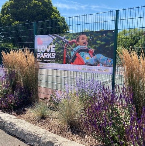 Sign reading 'Love Parks' placed in a green public space in Southend-on-Sea